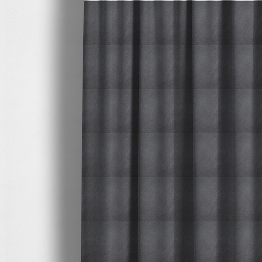 The fabric used to create these made-to-measure curtains is a textured charcoal grey fabric with a tight, uniform cross-weave.