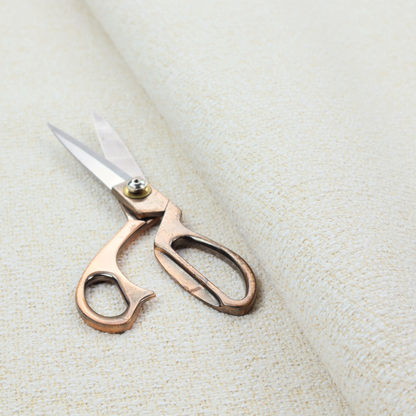 A textured cream and off-white woven fabric.