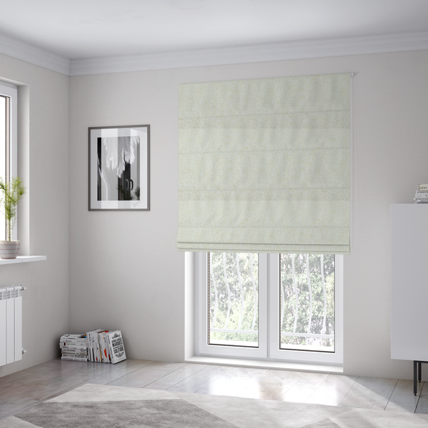 The fabric used to create these Roman blinds is a textured cream and off-white woven fabric.