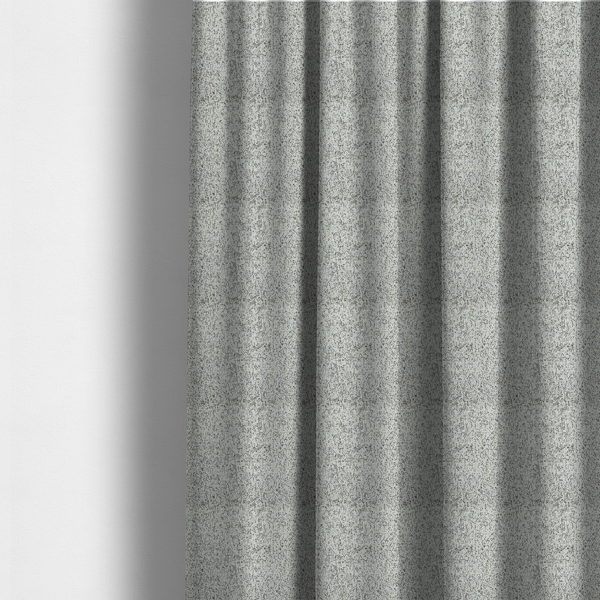 The fabric used to create these made-to-measure curtains is a cream, beige, and charcoal grey woven upholstery fabric swatch.