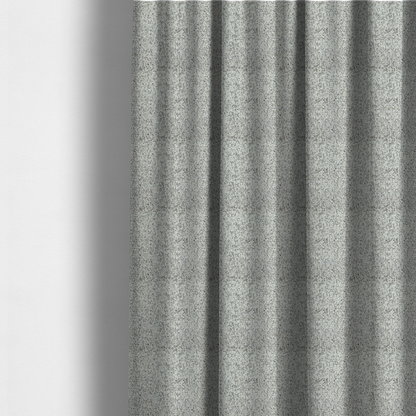 The fabric used to create these made-to-measure curtains is a cream, beige, and charcoal grey woven upholstery fabric swatch.