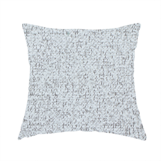 The fabric used to create this handmade cushion is a textured light grey and off-white woven fabric.