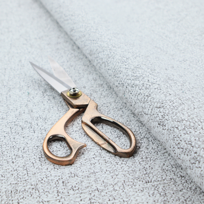 A textured light grey and off-white woven fabric.