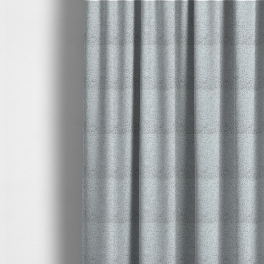 The fabric used to create these made-to-measure curtains is a textured light grey and off-white woven fabric.