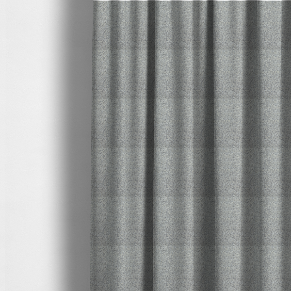 The fabric used to create these made-to-measure curtains is a textured mid-grey and off-white woven fabric.