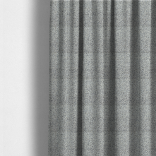 The fabric used to create these made-to-measure curtains is a textured mid-grey and off-white woven fabric.