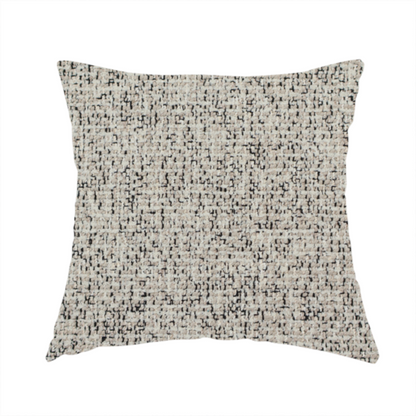 The fabric used to create this handmade cushion is a textured taupe, beige, and charcoal woven fabric swatch.