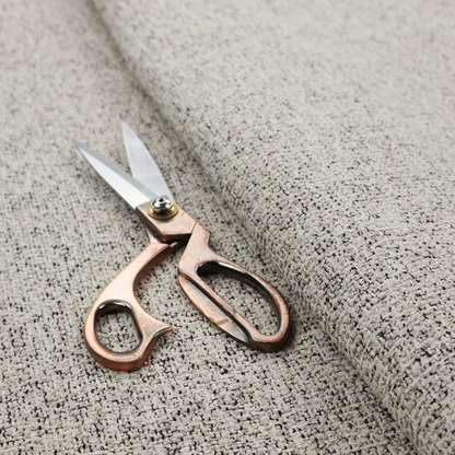 A textured taupe, beige, and charcoal woven fabric swatch.