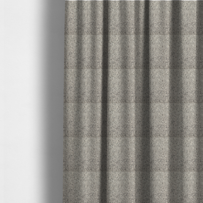 The fabric used to create these made-to-measure curtains is a textured taupe, beige, and charcoal woven fabric swatch.