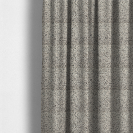 The fabric used to create these made-to-measure curtains is a textured taupe, beige, and charcoal woven fabric swatch.