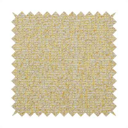 A textured yellow and beige woven fabric.