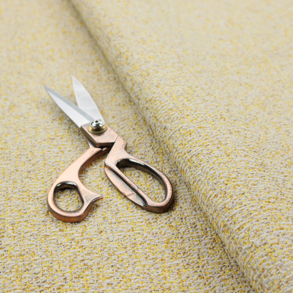 A textured yellow and beige woven fabric.