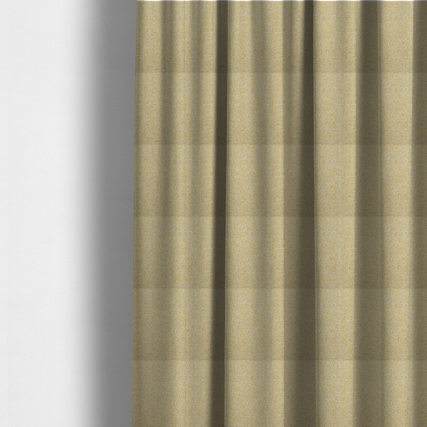 The fabric used to create these made-to-measure curtains is a textured yellow and beige woven fabric.