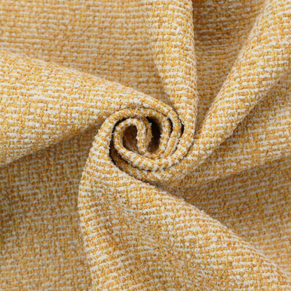 A textured mustard yellow and off-white woven upholstery fabric.
