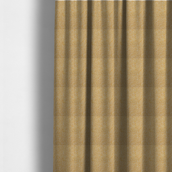 The fabric used to create these made-to-measure curtains is a textured mustard yellow and off-white woven upholstery fabric.