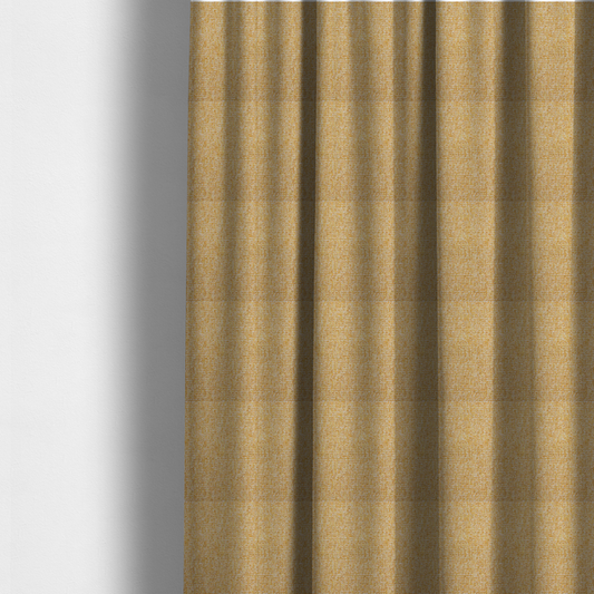 The fabric used to create these made-to-measure curtains is a textured mustard yellow and off-white woven upholstery fabric.