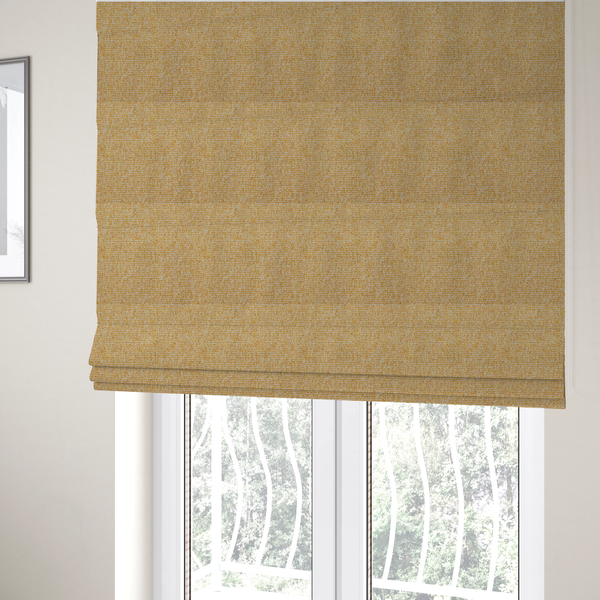 The fabric used to create these Roman blinds is a textured mustard yellow and off-white woven upholstery fabric.