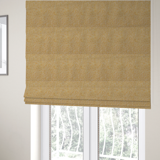 The fabric used to create these Roman blinds is a textured mustard yellow and off-white woven upholstery fabric.