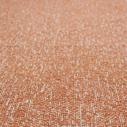 A textured terracotta orange and off-white woven upholstery fabric.
