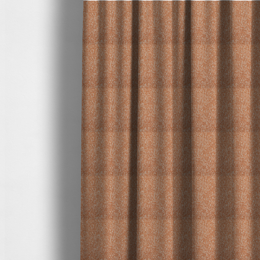 The fabric used to create these made-to-measure curtains is a textured terracotta orange and off-white woven upholstery fabric.