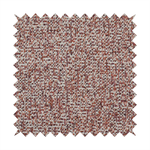 A textured rust red and beige woven upholstery fabric.