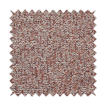 A textured rust red and beige woven upholstery fabric.