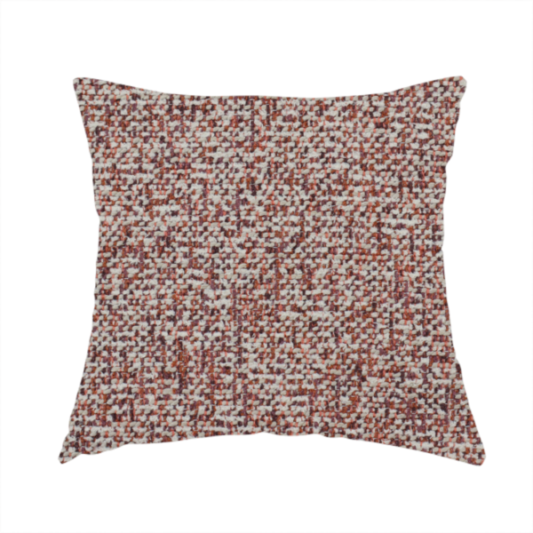 The fabric used to create this handmade cushion is a textured rust red and beige woven upholstery fabric.