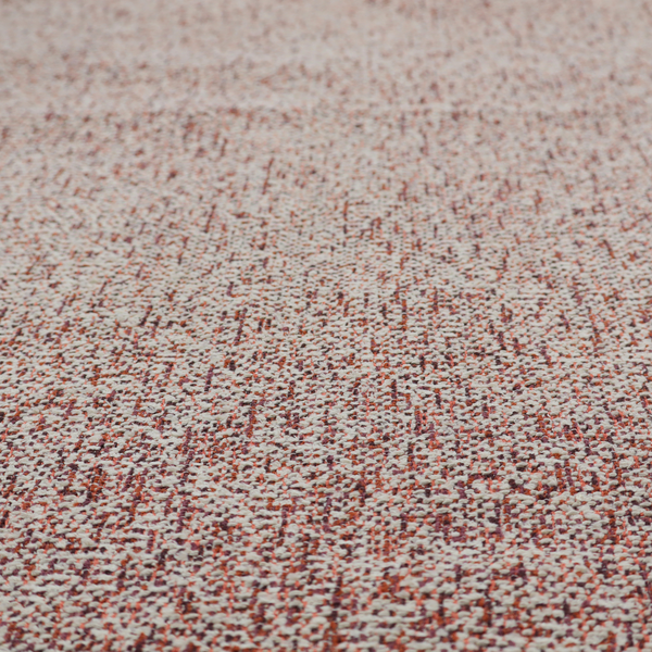 A textured rust red and beige woven upholstery fabric.