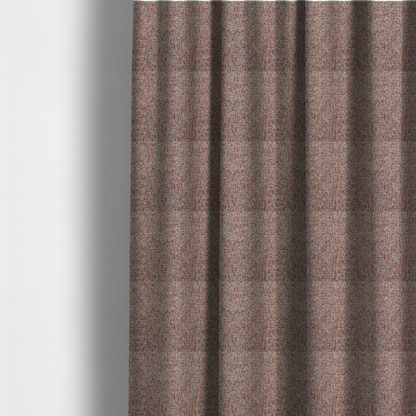 The fabric used to create these made-to-measure curtains is a textured rust red and beige woven upholstery fabric.