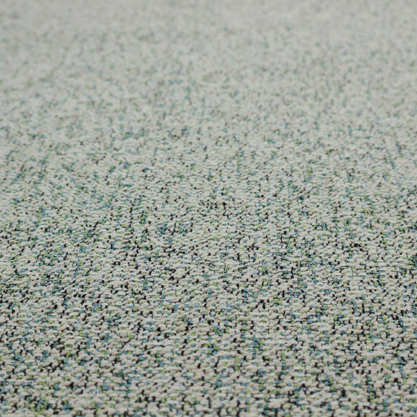 A multi-tonal teal and grey textured woven fabric swatch.
