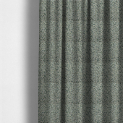 The fabric used to create these made-to-measure curtains is a multi-tonal teal and grey textured woven fabric swatch.