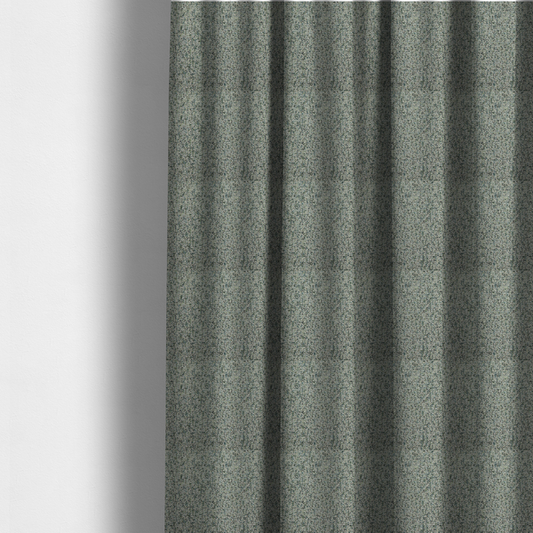 The fabric used to create these made-to-measure curtains is a multi-tonal teal and grey textured woven fabric swatch.