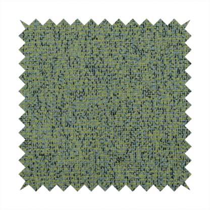 A textured moss green and teal woven upholstery fabric swatch.