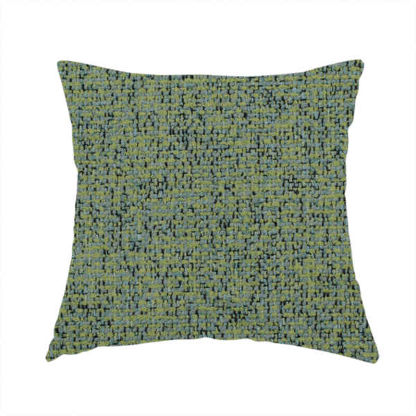 The fabric used to create this handmade cushion is a textured moss green and teal woven upholstery fabric swatch.