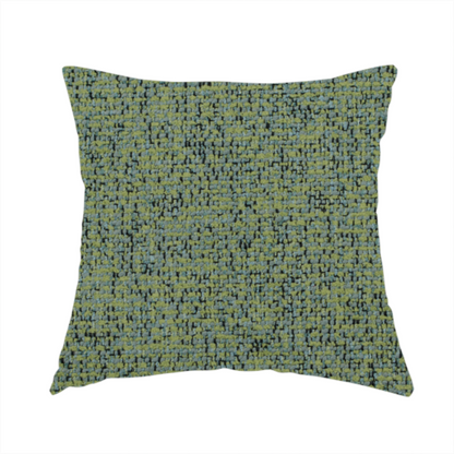 The fabric used to create this handmade cushion is a textured moss green and teal woven upholstery fabric swatch.