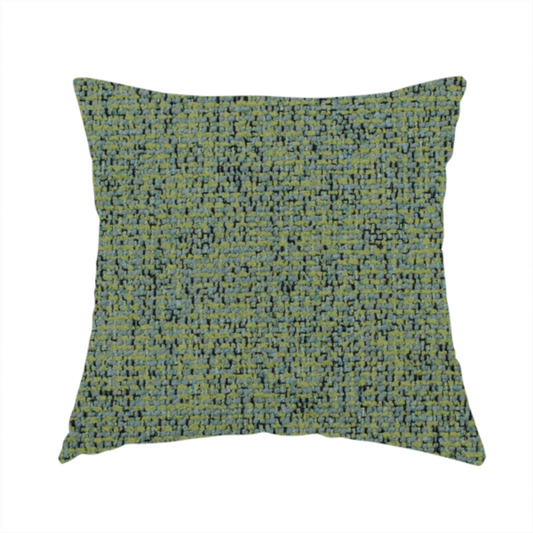 The fabric used to create this handmade cushion is a textured moss green and teal woven upholstery fabric swatch.