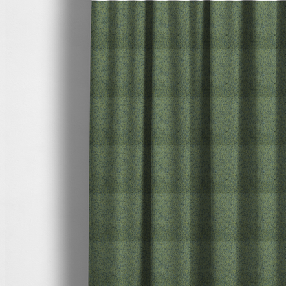 The fabric used to create these made-to-measure curtains is a textured moss green and teal woven upholstery fabric swatch.