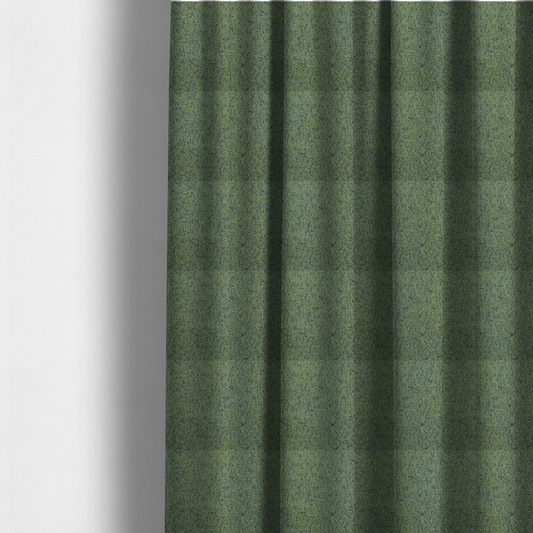 The fabric used to create these made-to-measure curtains is a textured moss green and teal woven upholstery fabric swatch.