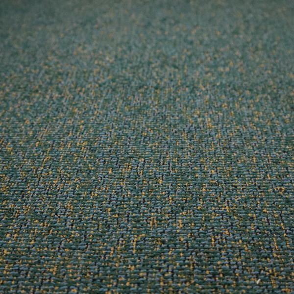 A multi-tonal forest green and gold textured woven fabric swatch.