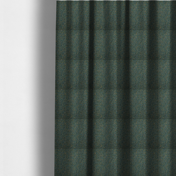 The fabric used to create these made-to-measure curtains is a multi-tonal forest green and gold textured woven fabric swatch.