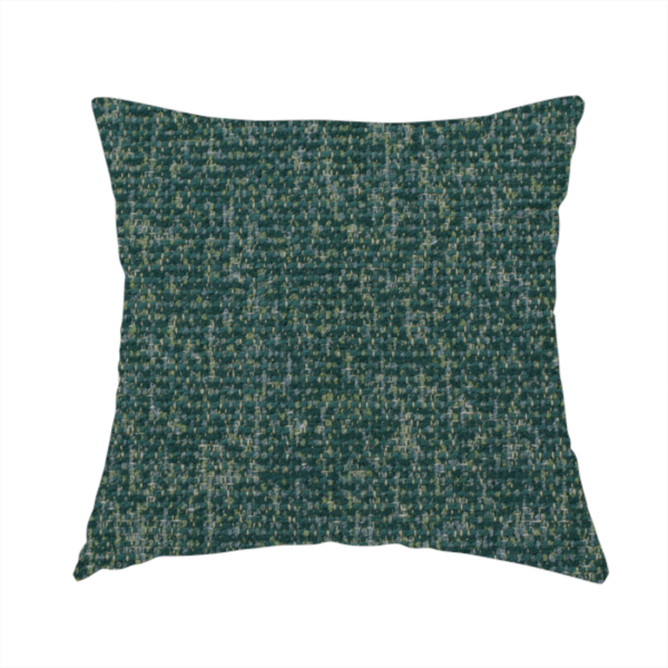The fabric used to create this handmade cushion is a multi-tonal emerald and dark green textured woven fabric swatch.