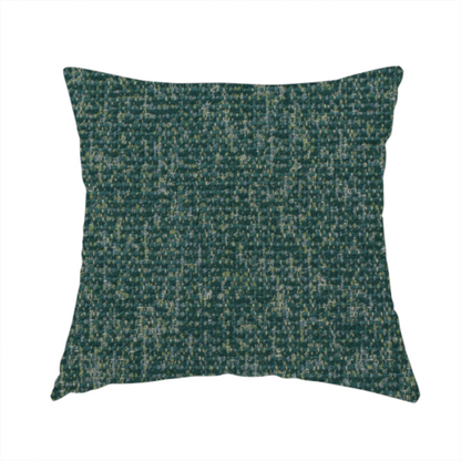 The fabric used to create this handmade cushion is a multi-tonal emerald and dark green textured woven fabric swatch.