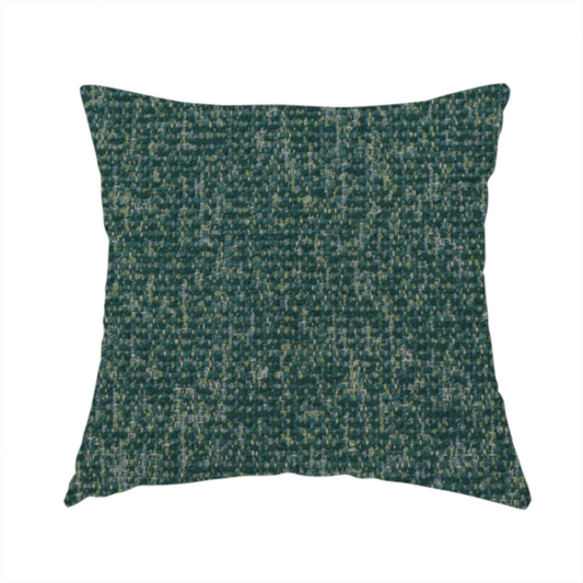 The fabric used to create this handmade cushion is a multi-tonal emerald and dark green textured woven fabric swatch.