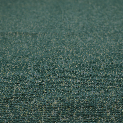 A multi-tonal emerald and dark green textured woven fabric swatch.
