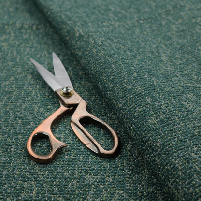 A multi-tonal emerald and dark green textured woven fabric swatch.