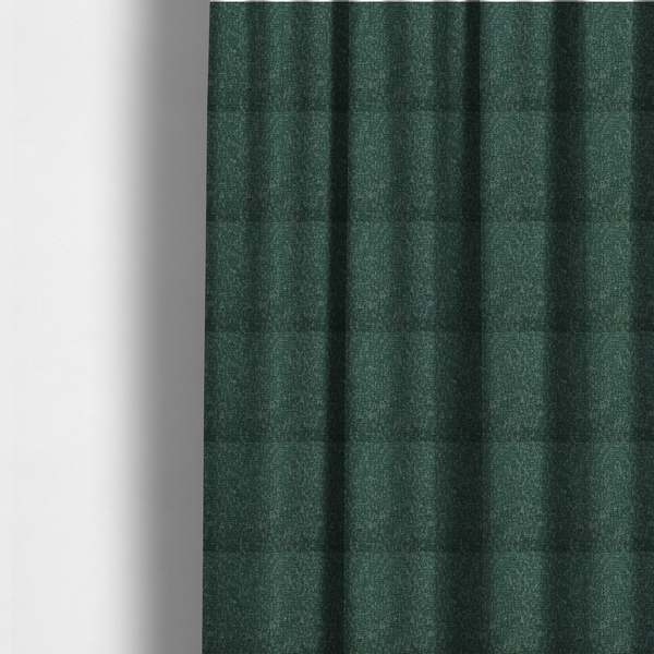 The fabric used to create these made-to-measure curtains is a multi-tonal emerald and dark green textured woven fabric swatch.