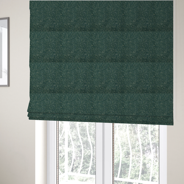 The fabric used to create these Roman blinds is a multi-tonal emerald and dark green textured woven fabric swatch.
