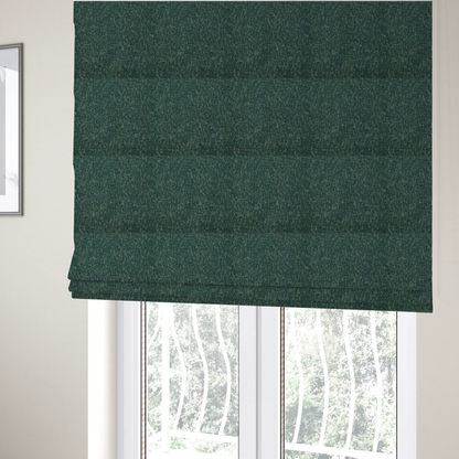 The fabric used to create these Roman blinds is a multi-tonal emerald and dark green textured woven fabric swatch.