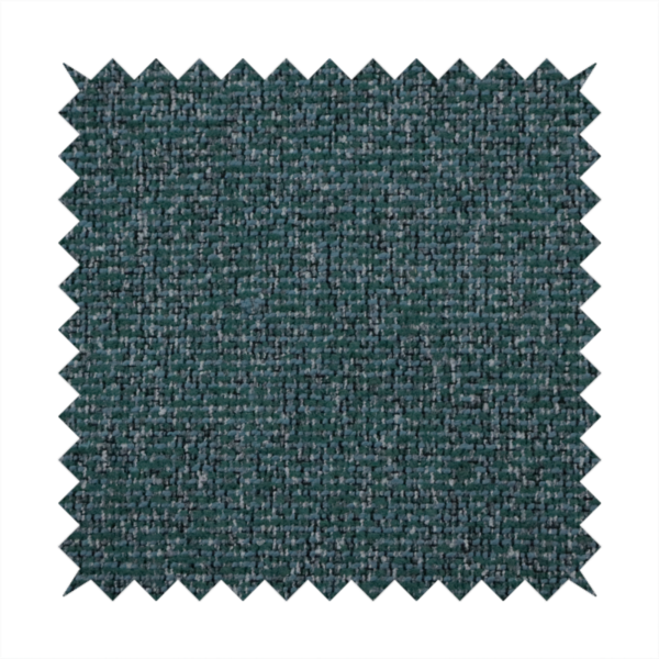 A multi-tonal deep teal and grey textured woven fabric swatch.