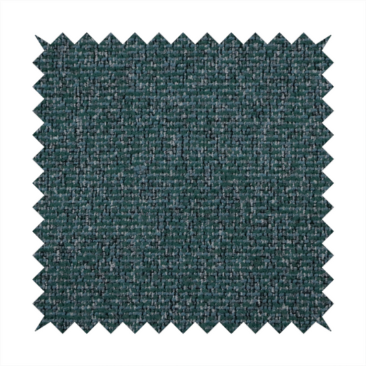 A multi-tonal deep teal and grey textured woven fabric swatch.